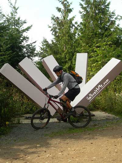 Mark Adriance circles the statue  Ridge Trail aboard his personal Santa Cruz Superlight